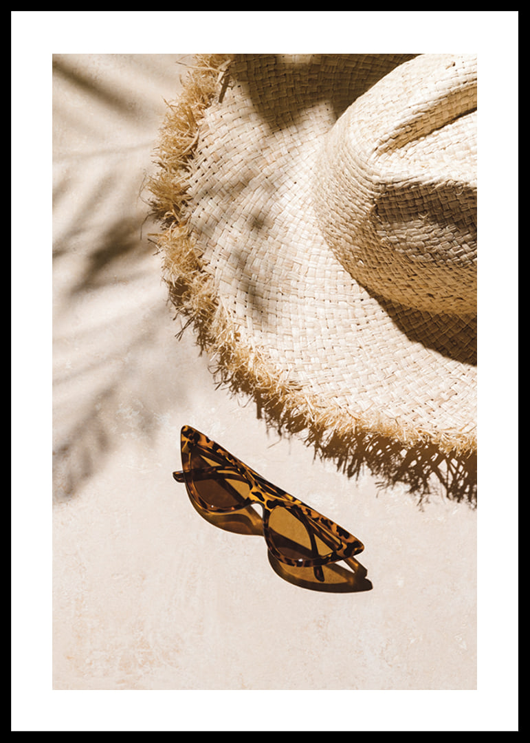 Photographic close-up of straw hat and patterned sunglasses-12