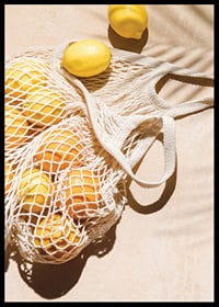 Photographic close-up of lemons in a mesh bag on a light background-6