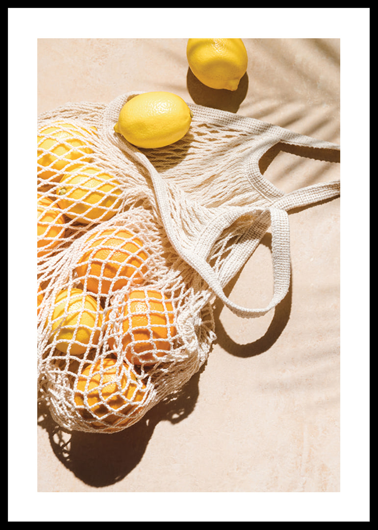 Photographic close-up of lemons in a mesh bag on a light background-12