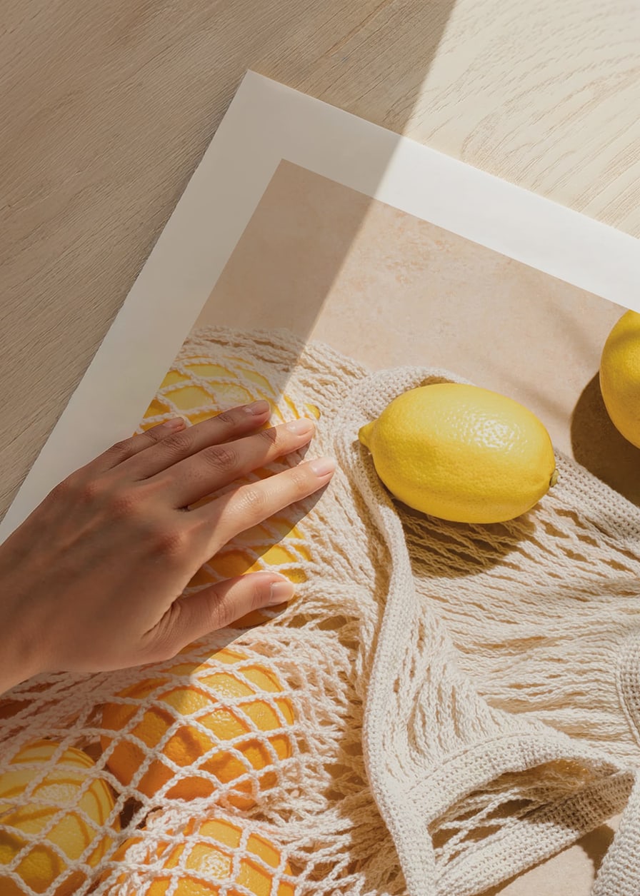 Photographic close-up of lemons in a mesh bag on a light background-12