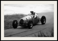 Black and white photography of classic racing car in motion-2