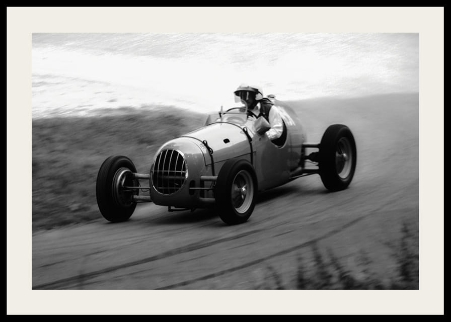 Black and white photography of classic racing car in motion-12