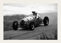 Black and white photography of classic racing car in motion-3
