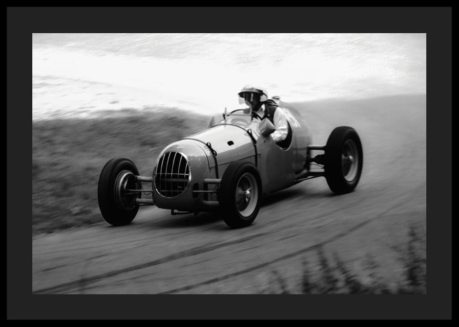 Black and white photography of classic racing car in motion-12