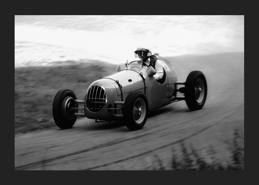 Black and white photography of classic racing car in motion-12