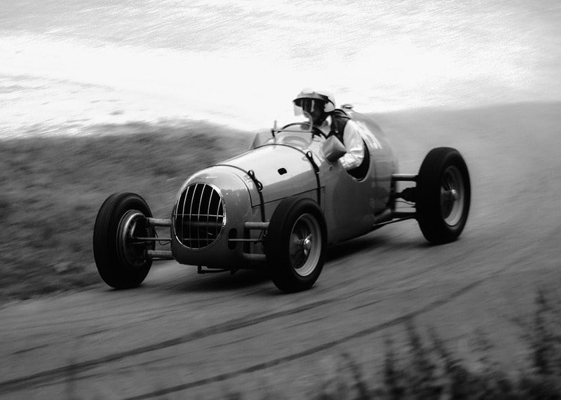 Black and white photography of classic racing car in motion-12