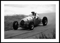 Black and white photography of classic racing car in motion-0