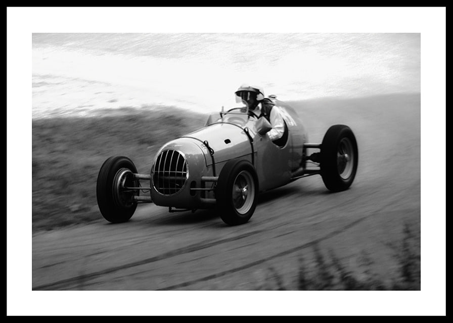 Black and white photography of classic racing car in motion-12