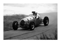 Black and white photography of classic racing car in motion-1