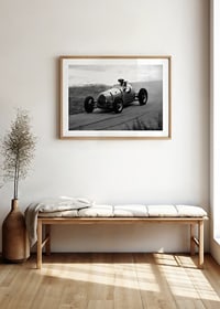 Black and white photography of classic racing car in motion-8