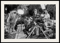Black and white scene with lion on bench and film recording-2