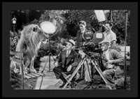 Black and white scene with lion on bench and film recording-4