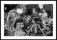 Black and white scene with lion on bench and film recording-0