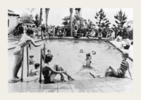 Black and white photo of pool party with bathers and spectators, 1930s-3