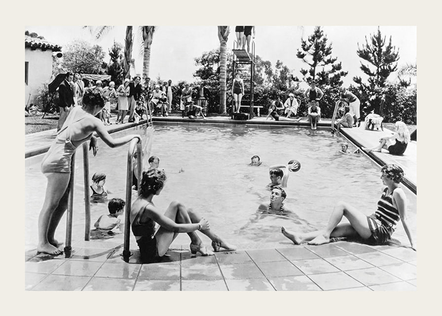 Black and white photo of pool party with bathers and spectators, 1930s-12