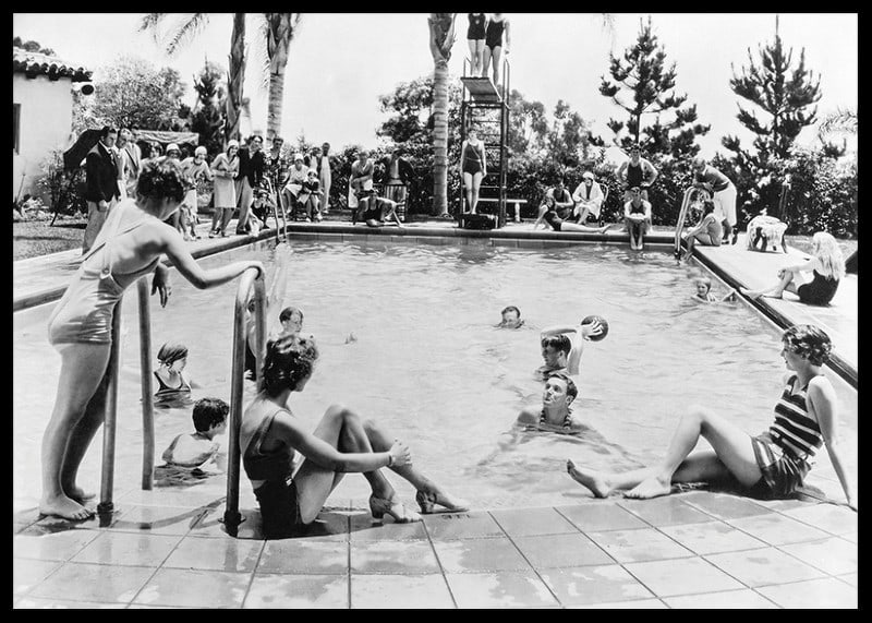 Black and white photo of pool party with bathers and spectators, 1930s-12