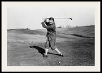 Black and white photograph of male golfer in classic attire-2