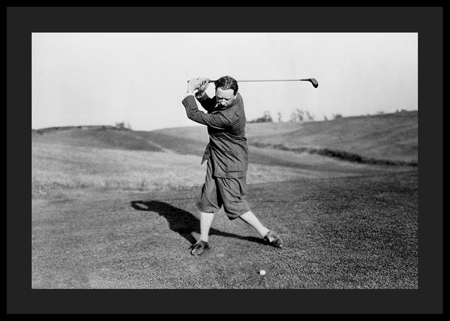 Black and white photograph of male golfer in classic attire-12