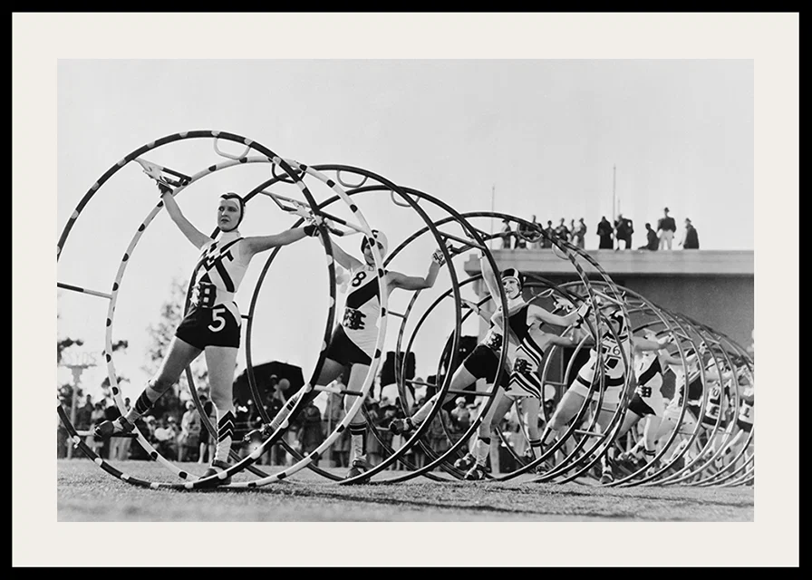 Black and white photo of female gymnasts with large hoops-12