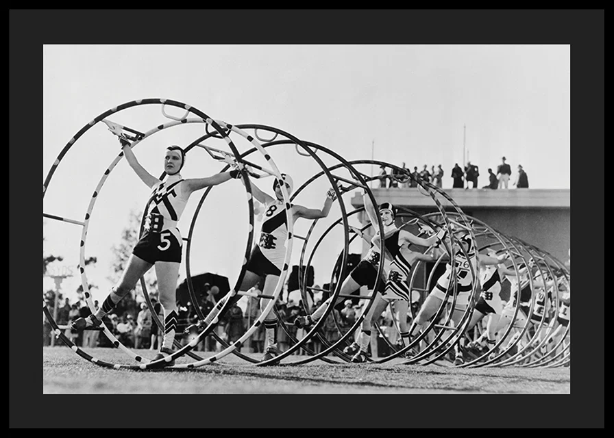 Black and white photo of female gymnasts with large hoops-12
