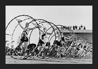 Black and white photo of female gymnasts with large hoops-5