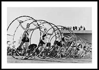 Black and white photo of female gymnasts with large hoops-0