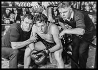 Black and white scene with boxer and two trainers in ring corner-6