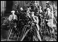Black and white photo of group of photographers with classic cameras-6