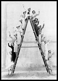 Black and white photograph of women in 1930s clothing on ladder-6
