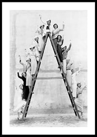 Black and white photograph of women in 1930s clothing on ladder-0