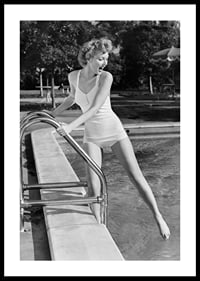 Black and white vintage photograph of woman at poolside in swimsuit-0