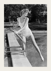 Black and white vintage photograph of woman at poolside in swimsuit-3