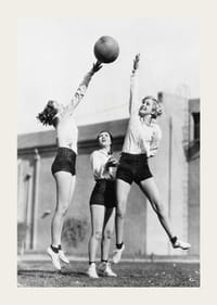 Black and white photograph of three women playing basketball outdoors-3