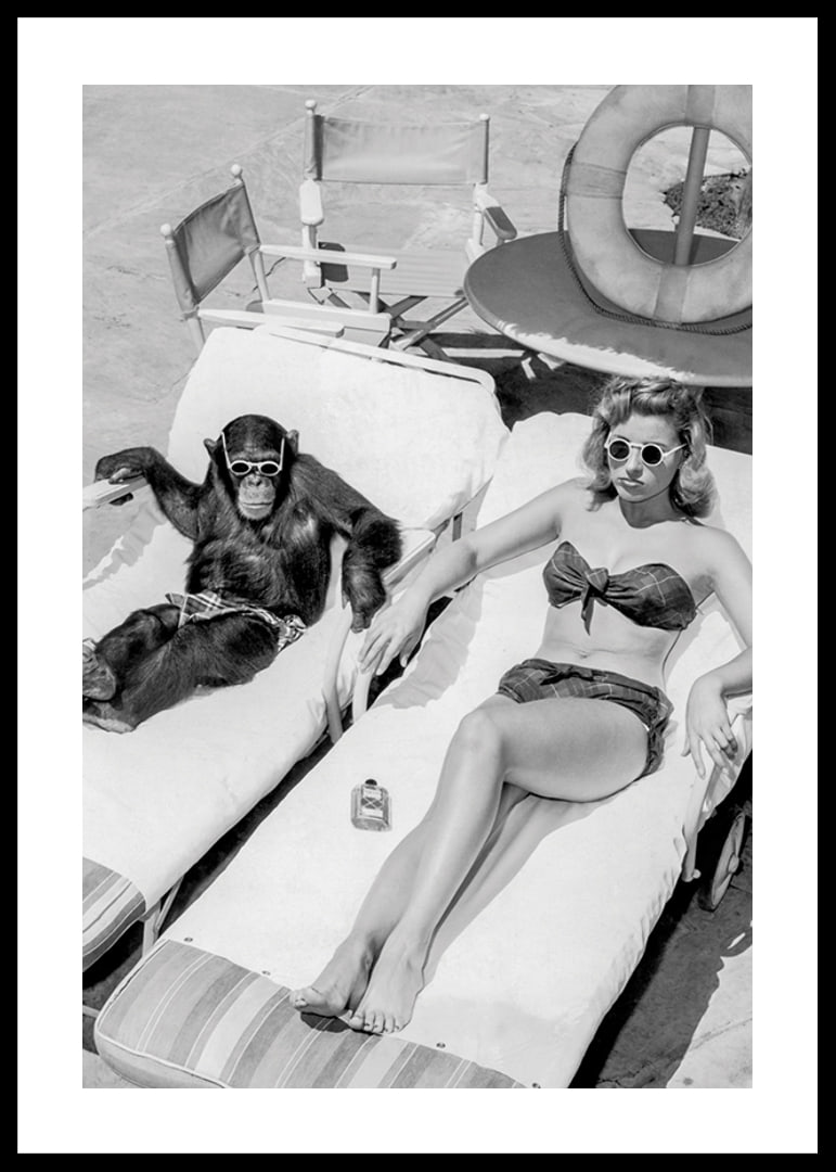 Black and white vintage photograph of woman and chimpanzee by pool-12