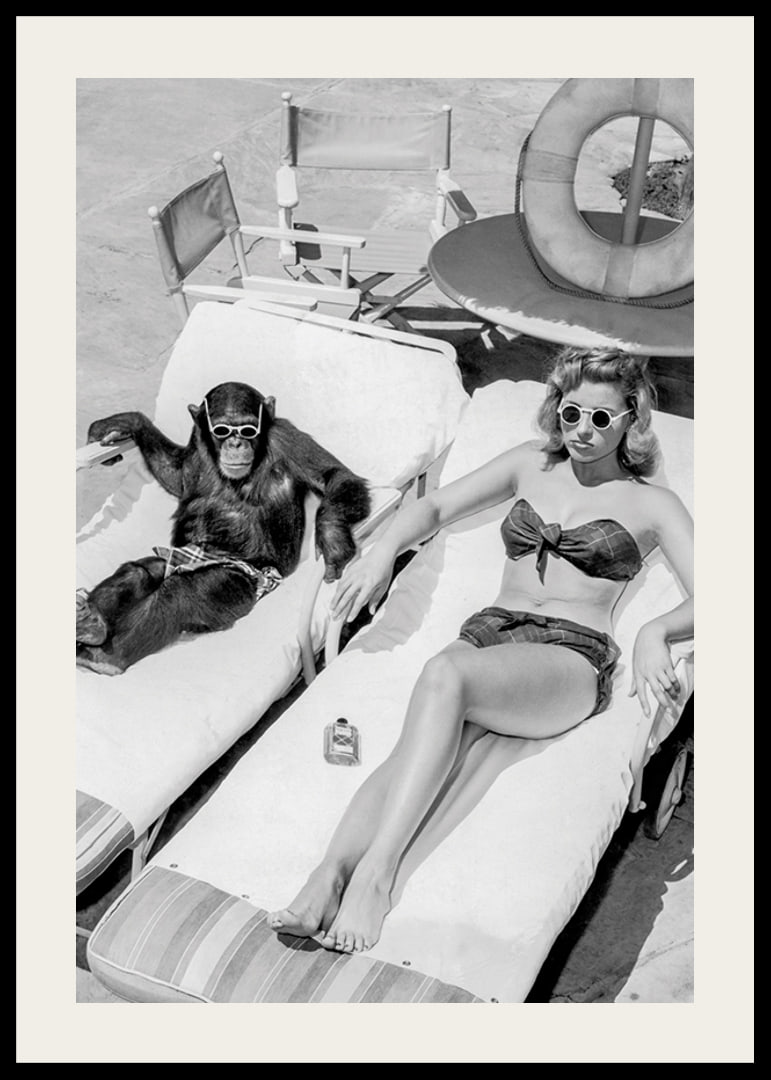 Black and white vintage photograph of woman and chimpanzee by pool-12