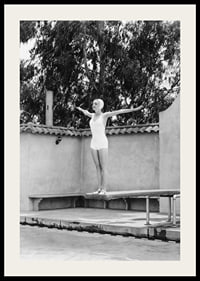 Black and white woman in swimsuit on trampoline at poolside-2