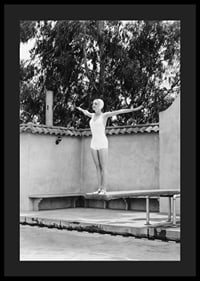 Black and white woman in swimsuit on trampoline at poolside-4