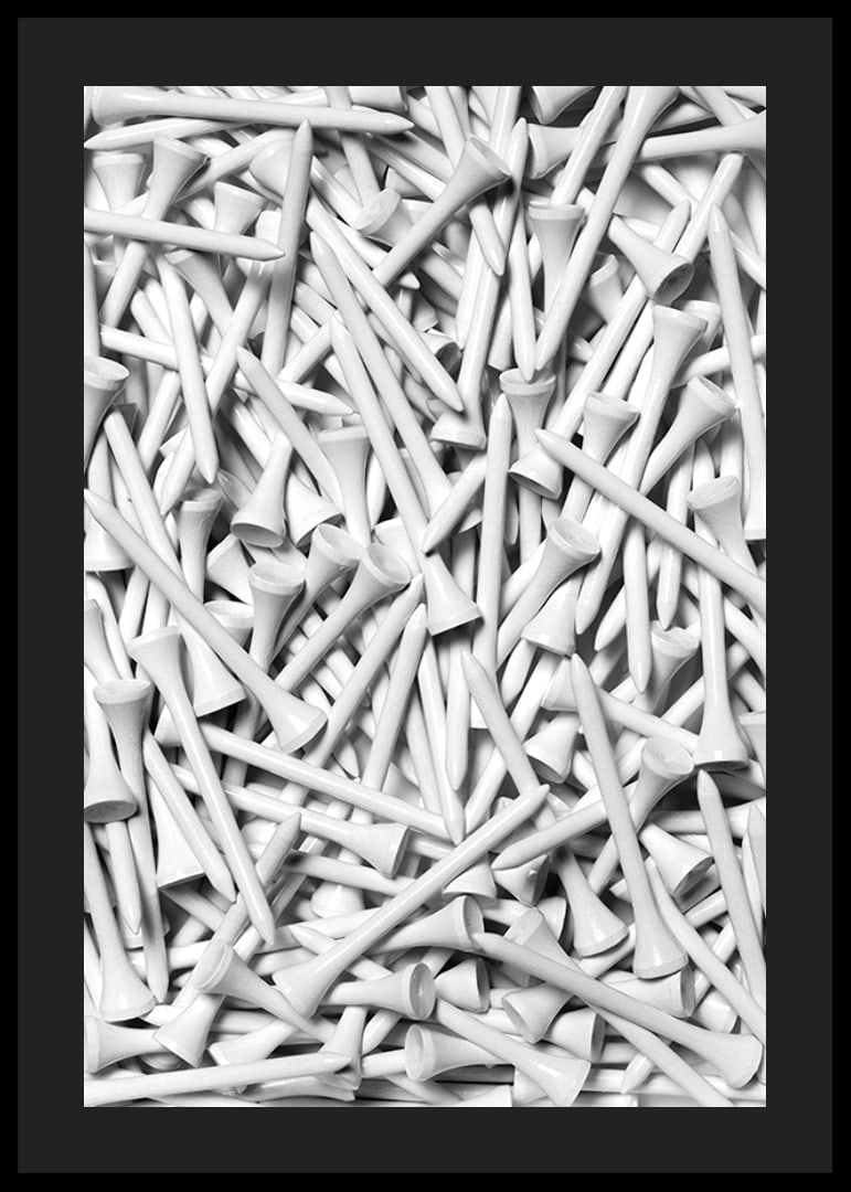 Close-up of white golf pegs in tight composition, black and white-12