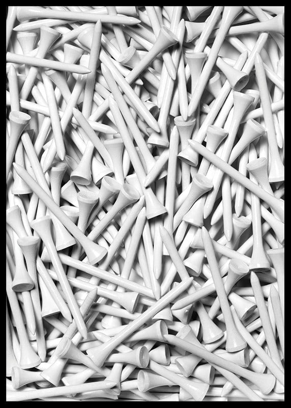 Close-up of white golf pegs in tight composition, black and white-12