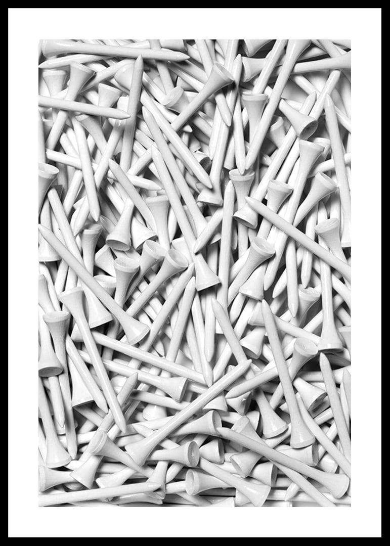 Close-up of white golf pegs in tight composition, black and white-12