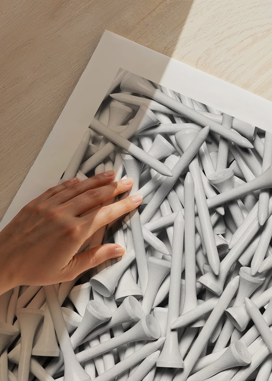 Close-up of white golf pegs in tight composition, black and white-12