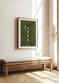 Golf club and four white golf balls on green lawn-8