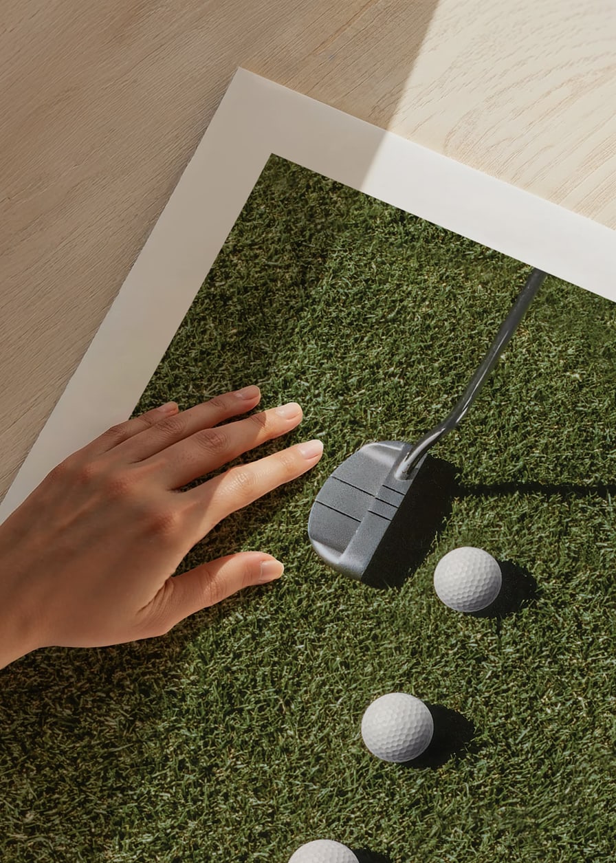 Golf club and four white golf balls on green lawn-12