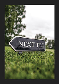 Photographic sign on golf course with the text Next Tee-5