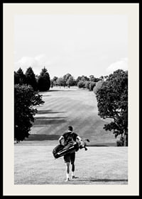 Golfer with bag against fairway in black and white landscape-2