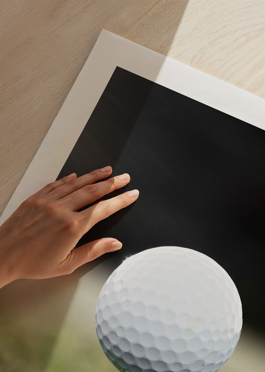 Photographic close-up of white golf ball on tee in grass-12