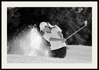 Black and white close-up of golfer in bunker shot, sand is smoking-2