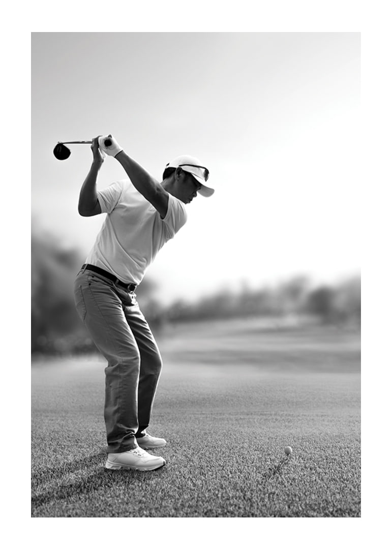 Black and white golfer in line with driver on fairway-12