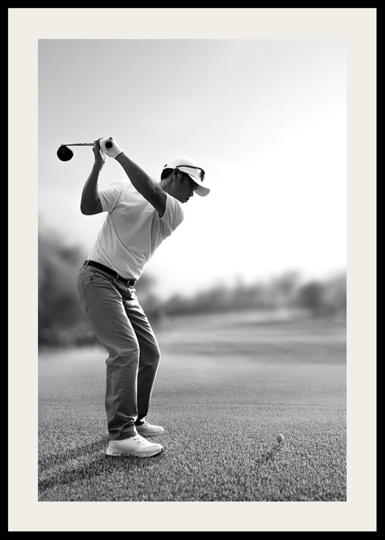 Black and white golfer in line with driver on fairway-12