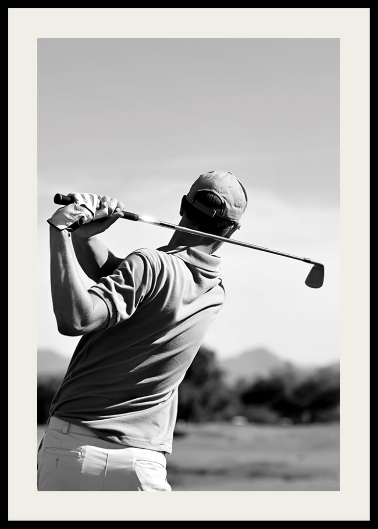 Black and white golfer swinging with club against bright sky-12